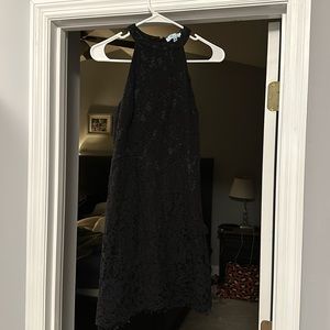 Short, black lace dress with unlined back.